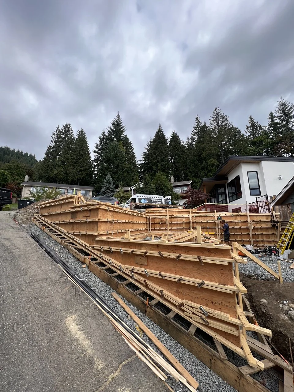 Foundation formwork and layout across a North Vancouver building site