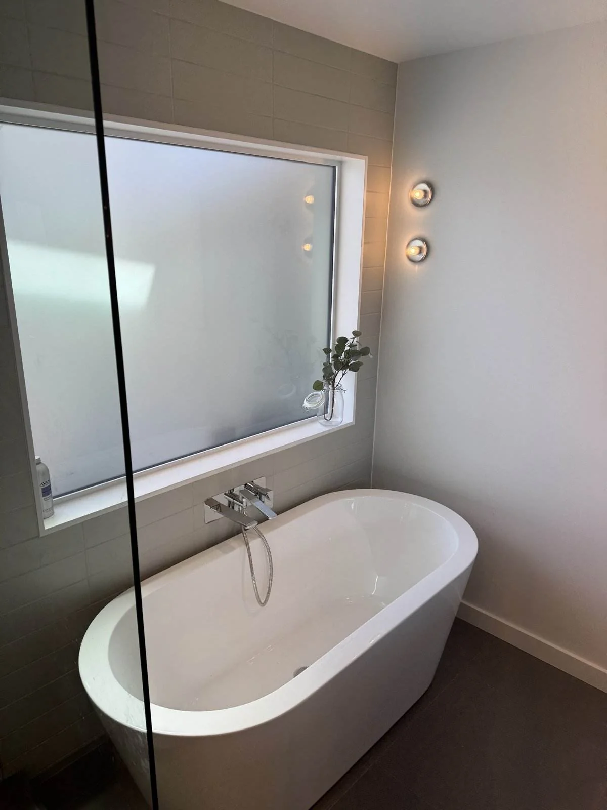Freestanding soaker tub in a custom home ensuite, North Vancouver
